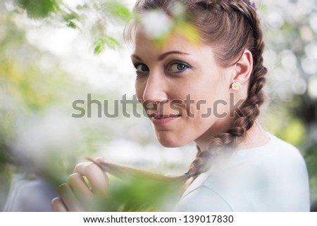 Young beautiful woman on nature