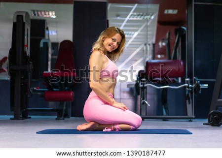 Blonde Woman in a gym 