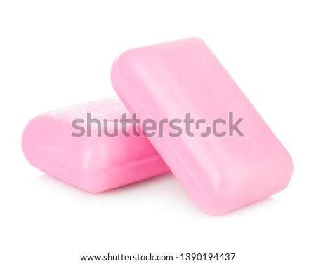 Pieces of pink soap isolated on white background. Royalty-Free Stock Photo #1390194437