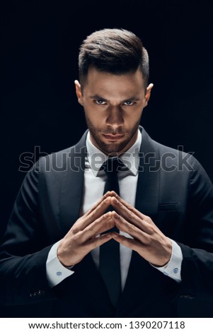 Young concentrated business man make sinister plans               Royalty-Free Stock Photo #1390207118