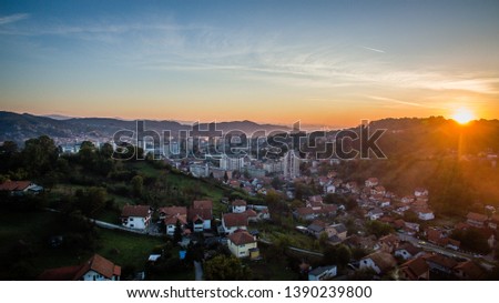Aerial view of downtown Tuzla at sunset, Bosnia. City photographed by drone, traffic and objects , landscape