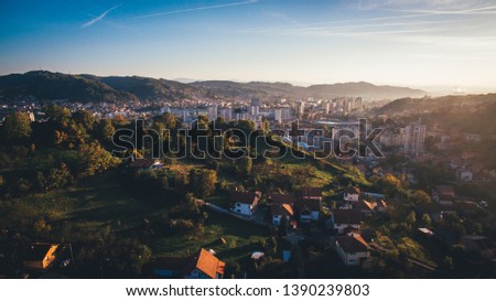 Aerial view of downtown Tuzla at sunset, Bosnia. City photographed by drone, traffic and objects , landscape
