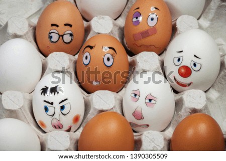 Funny eggs. This image is a funny egg on a white background. Faces on the eggs. Funny easter eggs
