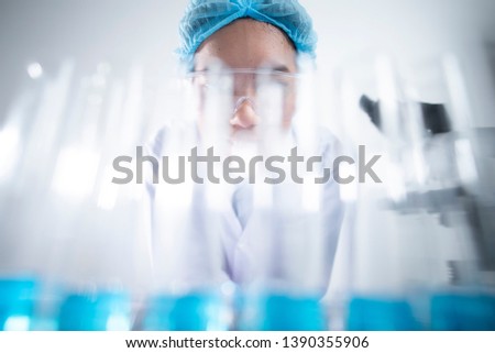 researcher working with glassware, glass equipment in scientific genetic laboratory. Healthcare and biotechnology