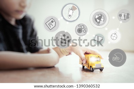 Asian boy playing with school bus.Education concept.
