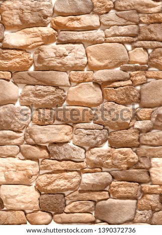 Decorative overlay stone in the form of coffee-colored cobblestones .Texture or background.