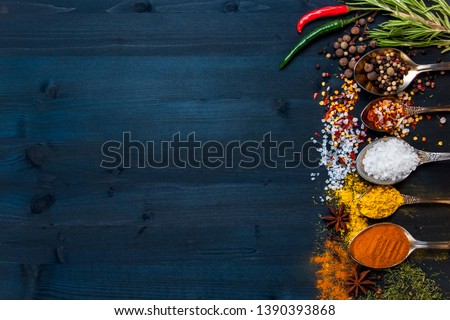 Set of seasonings and spices on a wooden blue background