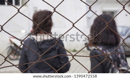 Wire fence to feel worry and silent and lonely. Want freedom and escape conceptual photography. It is the end of the road. No exit. No more way. Concept of a prison. Barbed wire. 
