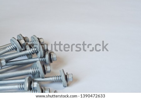 Screws photo background. Metal screws are used to fasten insulation panels to the metal frame of a new building.
