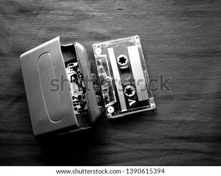 old fashioned music cassette and walkman player in black and white shot