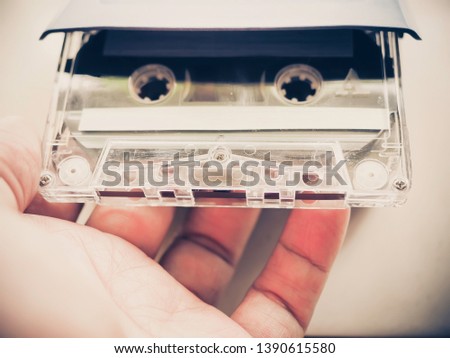 old fashioned music mix-tape cassette in the hand