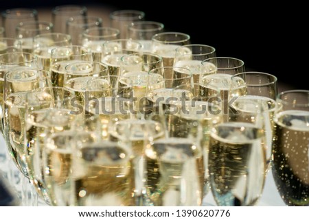 Beautiful champagne glasses on a wedding table setting for celebration of marriage and love for the Mr and Mrs