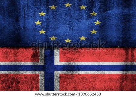 two flags on a cracked wall, the European Union and Norway