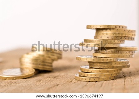 Stacks of coins on a wooden table. Business concept and growth of capital