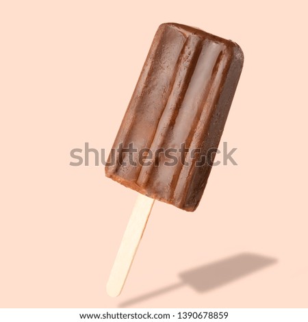 Chocolate popsicle on the sticks, frozen juice. Bright color, summer mood. Ice cream, freshness, Isolate, on a pink background