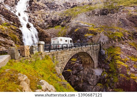 Tourism vacation and travel. Camper van in summer mountains landscape. National tourist route Trollstigen Trolls Path. Royalty-Free Stock Photo #1390687121