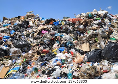 Pile of domestic garbage in landfill Royalty-Free Stock Photo #139068833