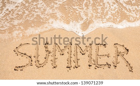 word summer on the yellow sandy beach