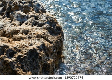 Rock and blue sea background