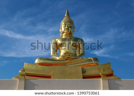 Big golden Buddha statue with a blue sky, Luang Pho Sothon