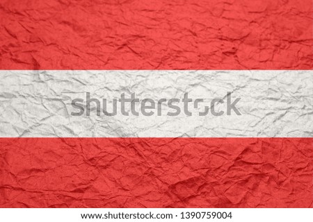 Austria flag on old crumpled craft paper. Textured background wallpaper for design.