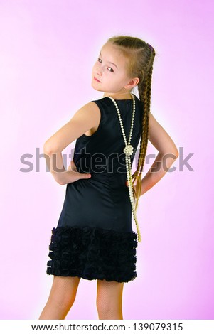 The image of the girl with a string of pearls on a white background 