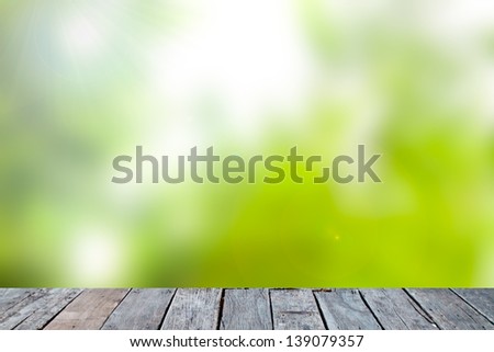 Green abstract blur nature background and wood.