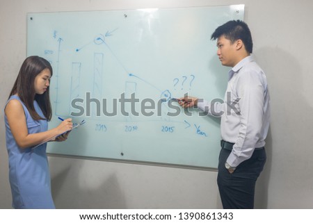 Manager explaining business plans to his employee