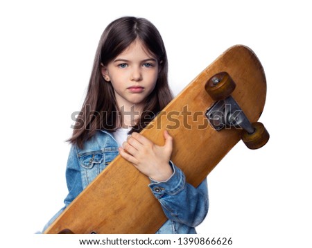 young girl with skateboard, isolated on white