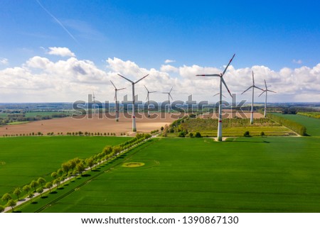 aerial view of windmills or turbines at an agricultural field