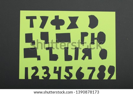 Cyrillic font of paper on a black background