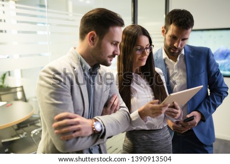 Picture of businesspeople using digital tablet in office