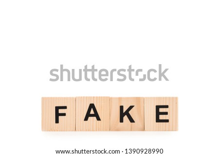 black fake word made of wooden blocks isolated on white