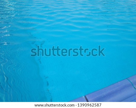 The edge of the pool in the blue pool or various areas of the pool and the background