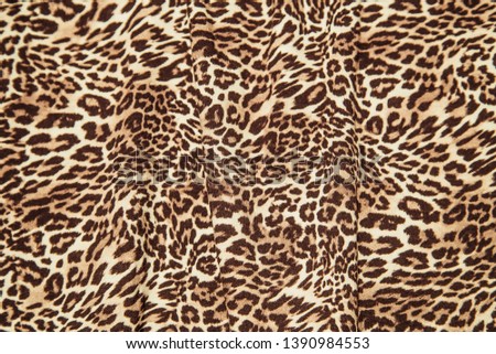 Leopard print patter fabric texture background effect leopard fabric sample.
