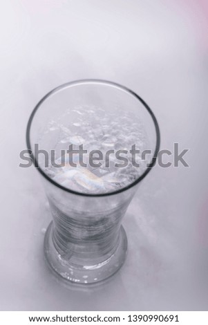 Foam in a transparent glass cup