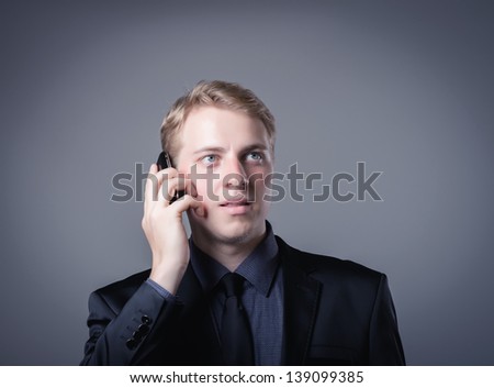 young businessman talking on a smartphone