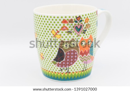 Coffee mug with tow owls on the side.