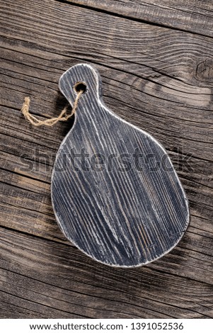 Russia, rustic old vintage wooden cutting board for the kitchen, with a groove structure, stripes, lies, stands on the table are cracks, black, brown, round square oval right angles sharp, rope