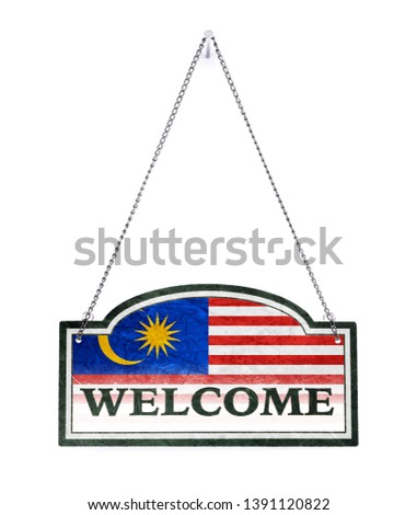 Malaysia welcomes you! Old metal sign isolated on white