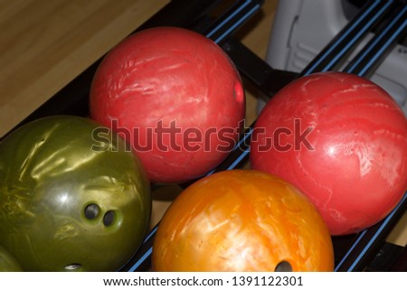 Different color bowling balls ready for play