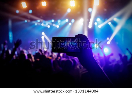 Photo for social networks at the concert, Mobile phone on music show
