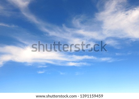 the bright blue sky background with some white cloud    