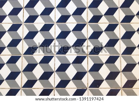The floor of retro tiles. Repeating geometric patterns of dice on the floor of ceramic tile.
