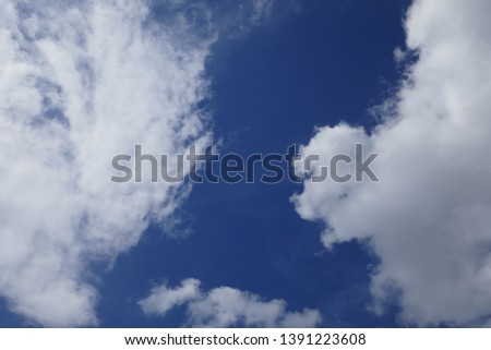 View into the beautiful sky with clouds on a sunny day