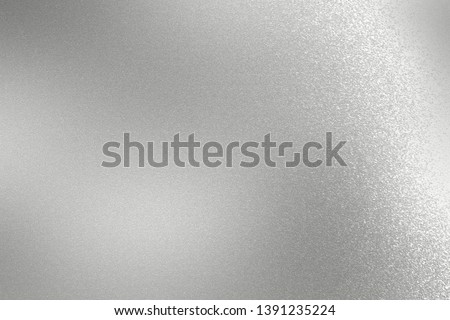 Scratches on silver metallic sheet, abstract texture background
