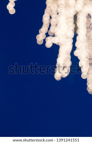 Abstract yellow light Boken background with copy spaec blue backdrop
