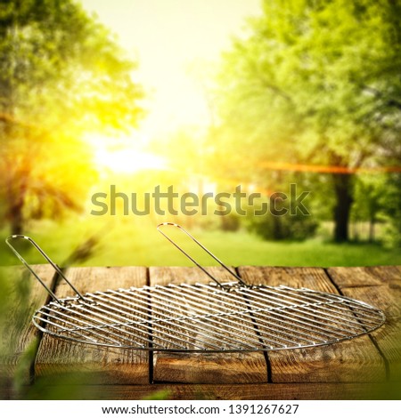 Table background of free space for your decoration and grill time in garden 
