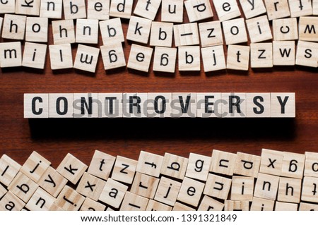 Controversy word concept on cubes Royalty-Free Stock Photo #1391321849