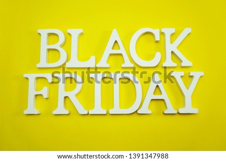 Black Friday sale shopping concept alphabet on yellow background